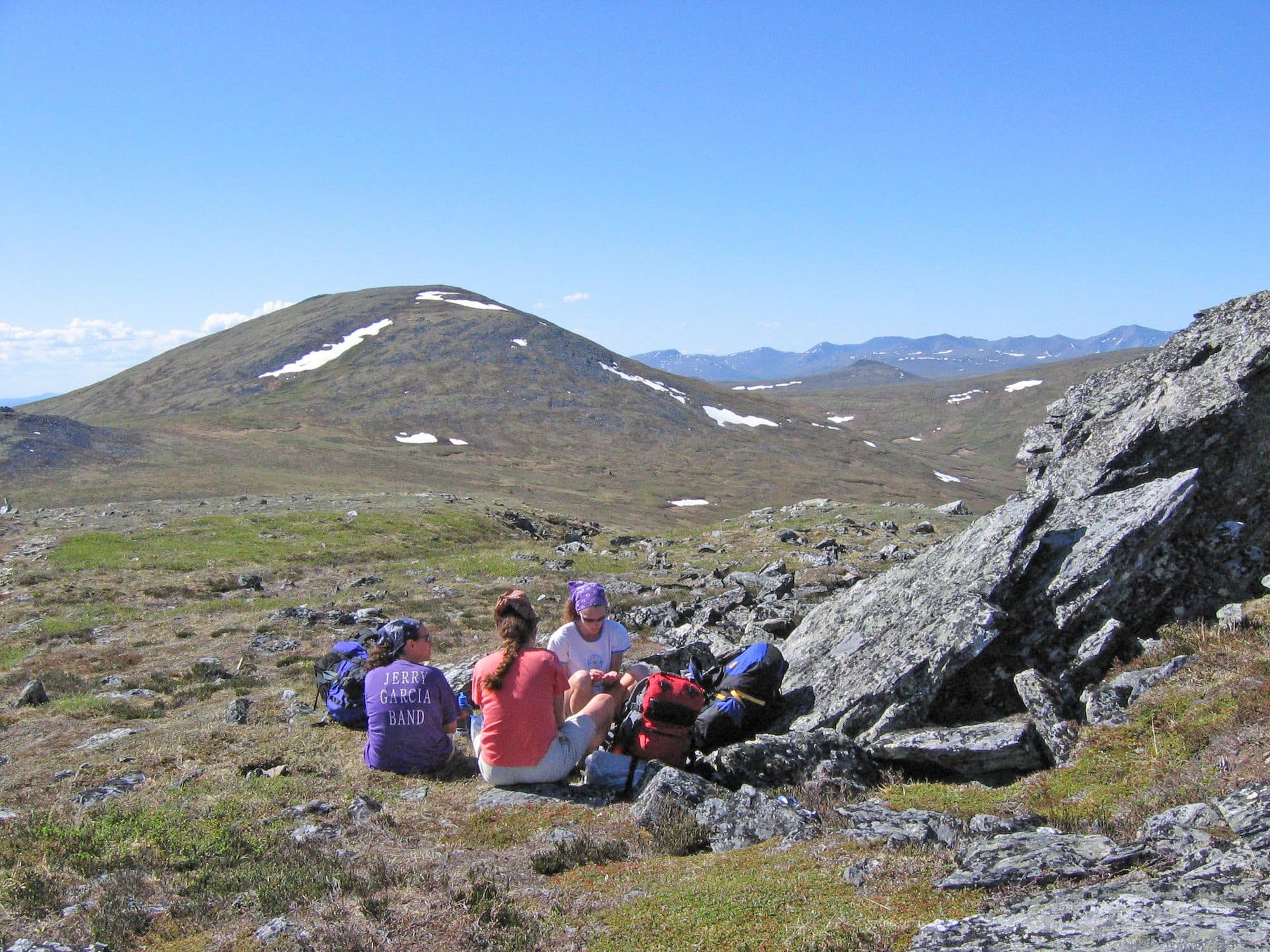 Group of travellers on a mountain trail
