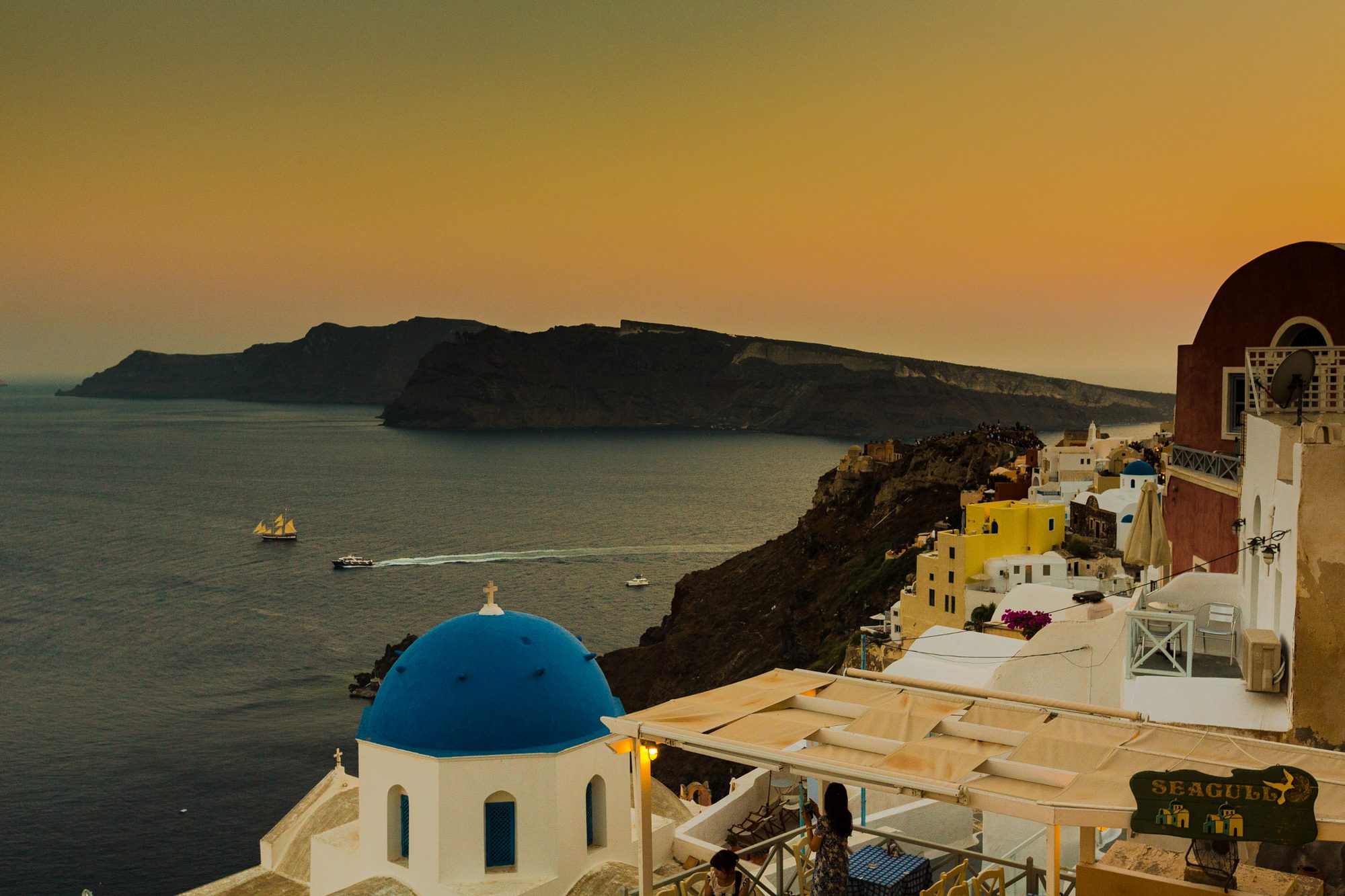 The stunning Oia sunset viewed from the caldera cliffs
